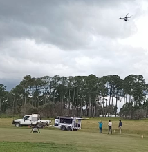 Ute and trailer setup with drones flying