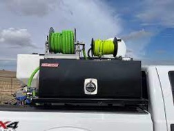 rolls of cable on top of a ute tray